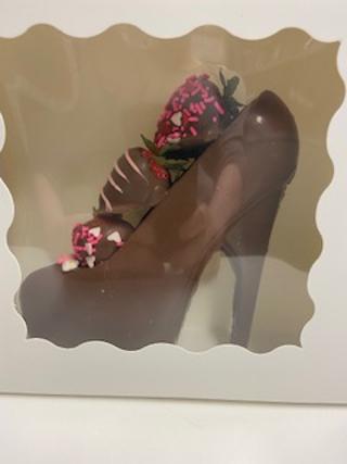 Chocolate Shoe with chocolate covered Strawberries.